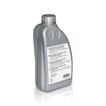 A silver-grey 1-liter bottle of special oil for IDEAL document shredders against a plain white background. The bottle has a transparent, vertical viewing strip on the side to show the fill level and a white sticker with the contents information.
