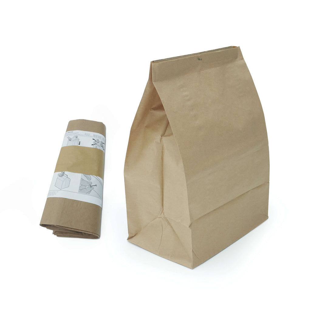 Vor weißem Hintergrund ist eine Verpackungseinheit mit fünf Papierfaltsäcken als Zubehör für IDEAL Aktenvernichter zu sehen. Abgebildet sind eine Rolle mit Säcken und ein aufgefalteter Sack.