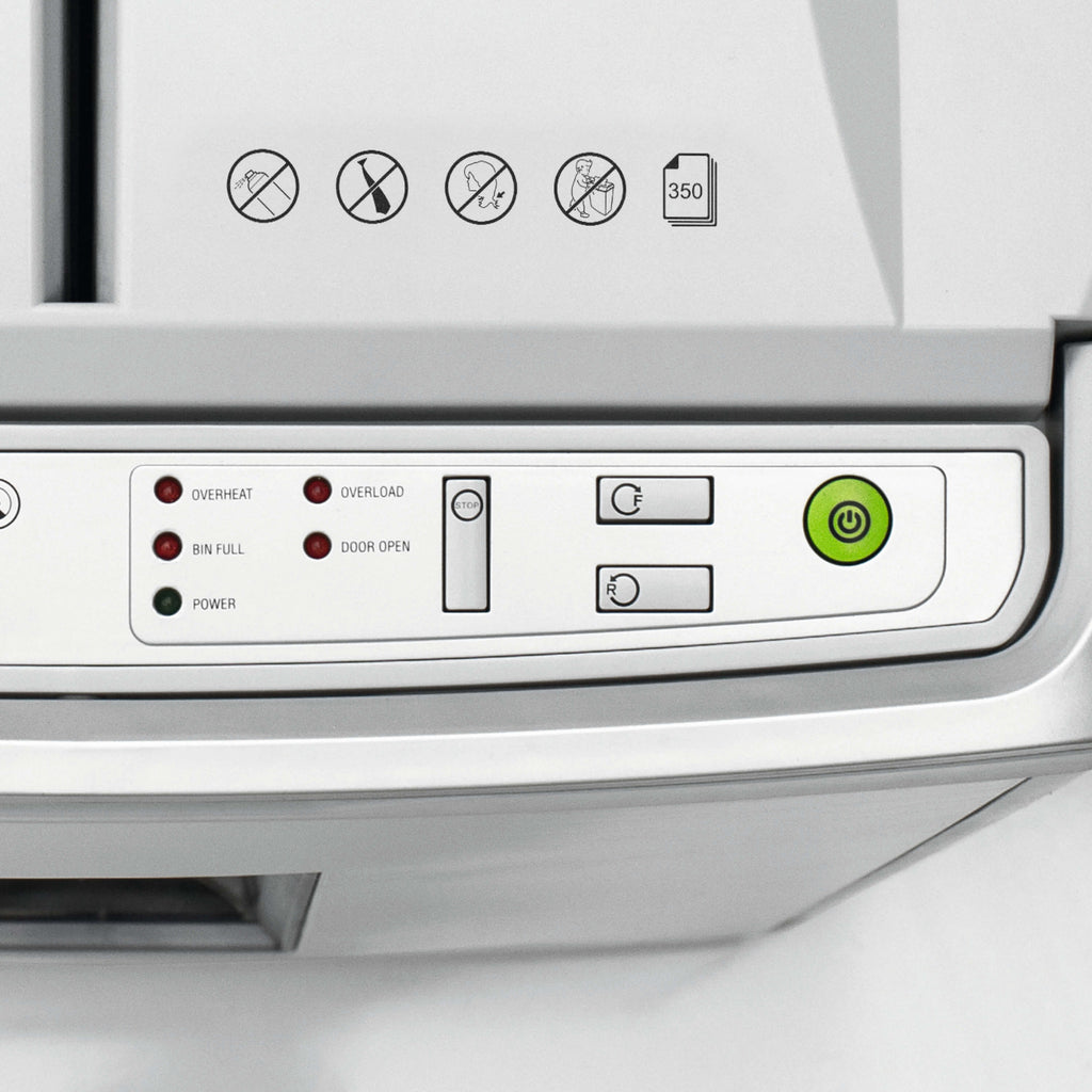 Control panel of the IDEAL Shredcat 8285 document shredder with various indicator lights and buttons. Various outlined warnings on the top of the device.